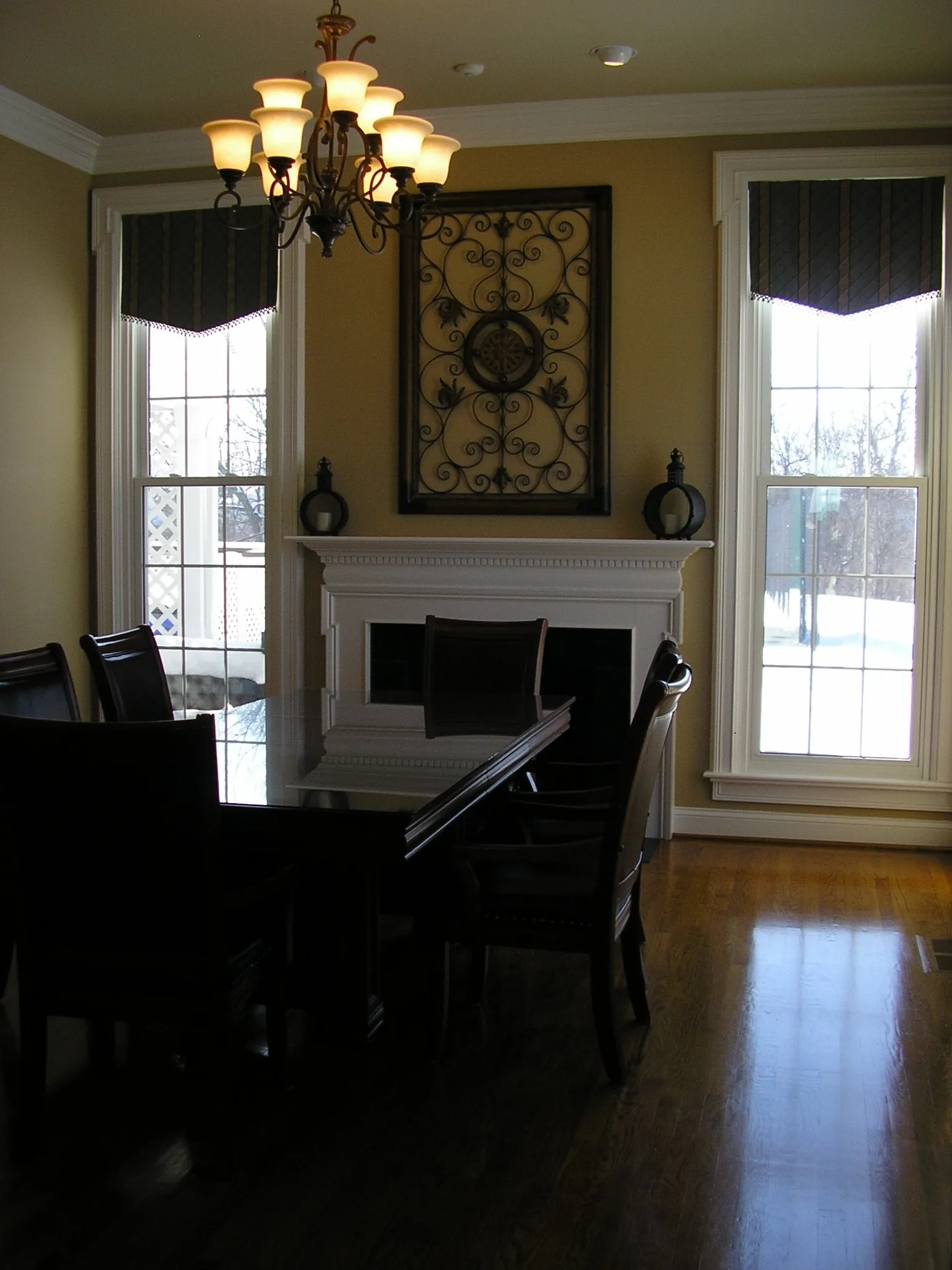 The dining area set with tables and a chandelier