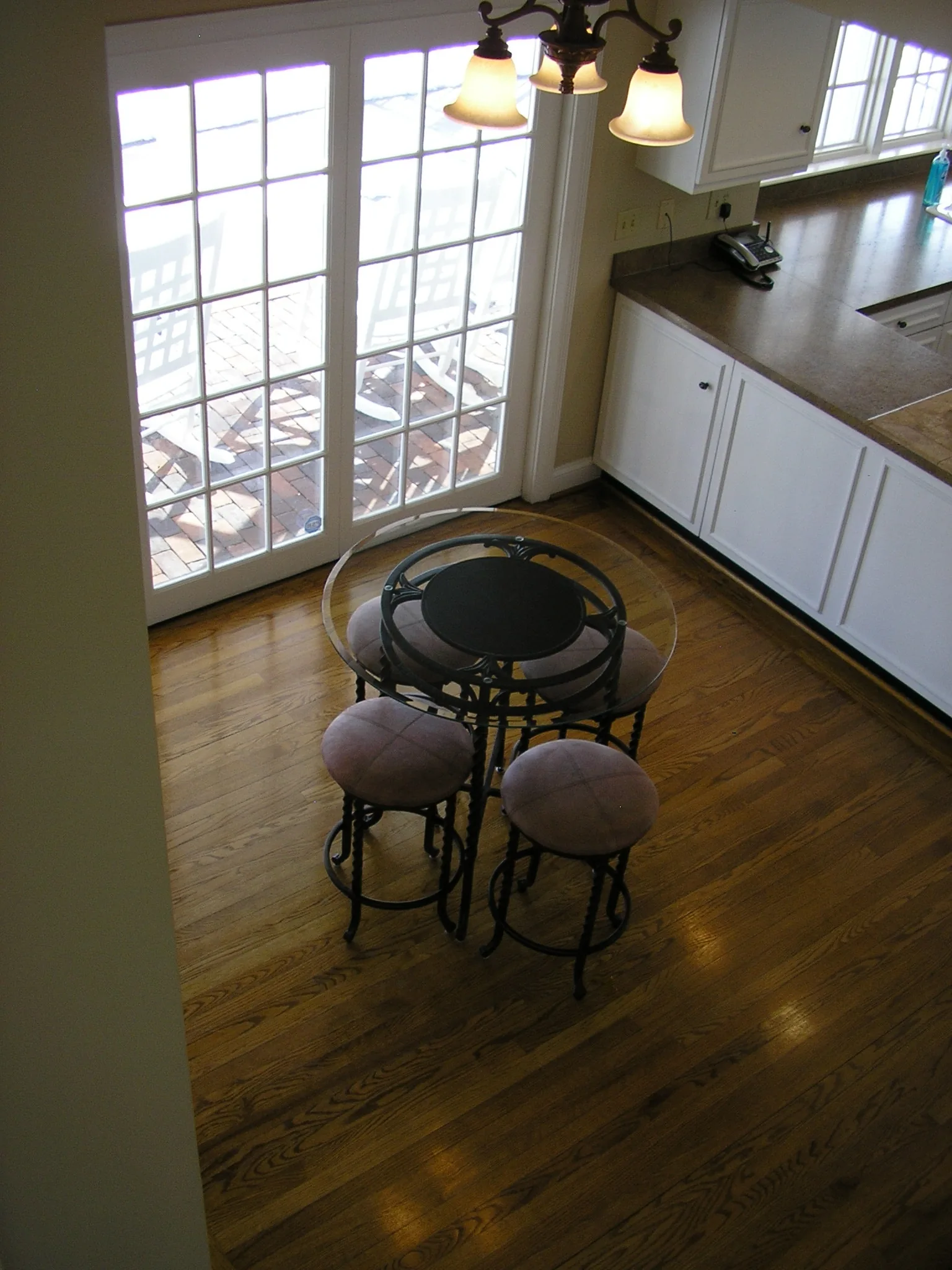 A corner of the clubhouse with a high-top table and stools